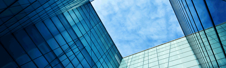 image of skyscrapers blue sky and light white clouds