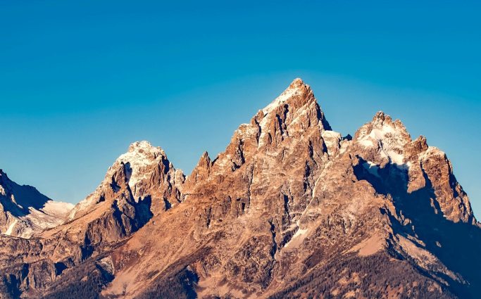 Mountains with blue sky in background