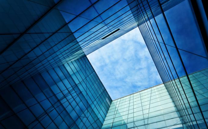 Blue sky through building