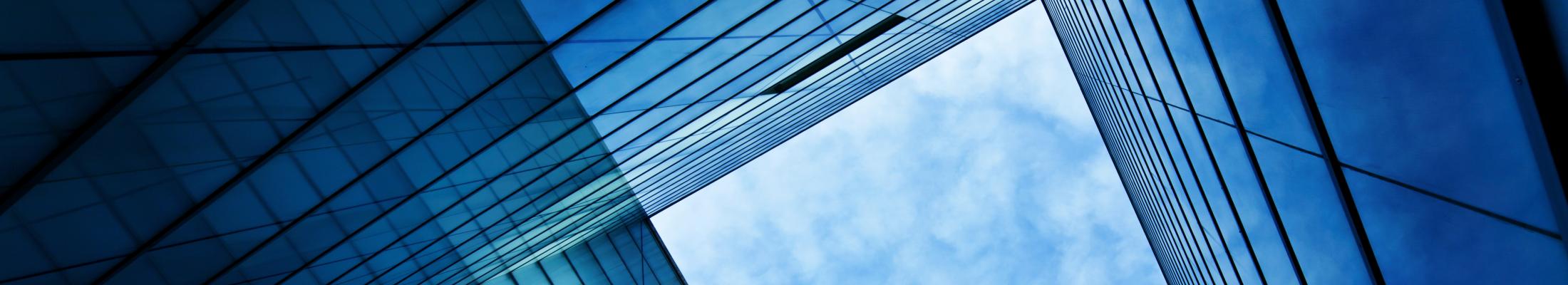 Blue sky through building