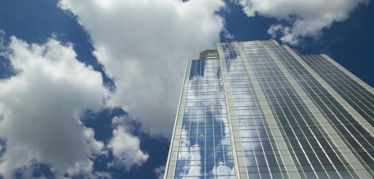 skyscraper with blue clouds