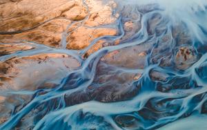 A glacial rivers from above. Aerial photograph of the river streams from Icelandic glaciers. 