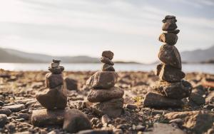 Tower of balancing rocks on beach