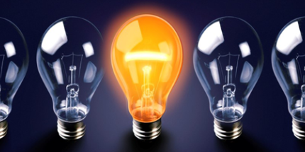 Seven Light bulbs with the middle light bulb turned on