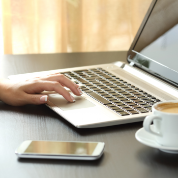 woman on laptop with coffee