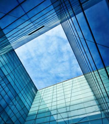 Blue sky through building