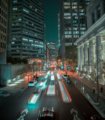 Speeding cars on a city street