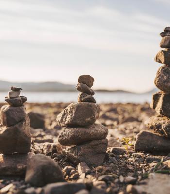 Tower of balancing rocks on beach
