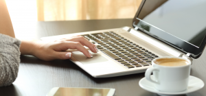 woman on laptop with coffee